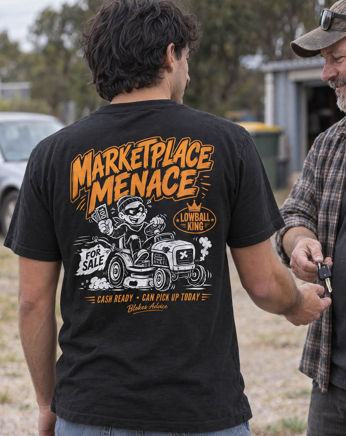 Back of the Marketplace Menace Tee: Lowball King cartoon on a ride-on mower with a Cash Ready banner